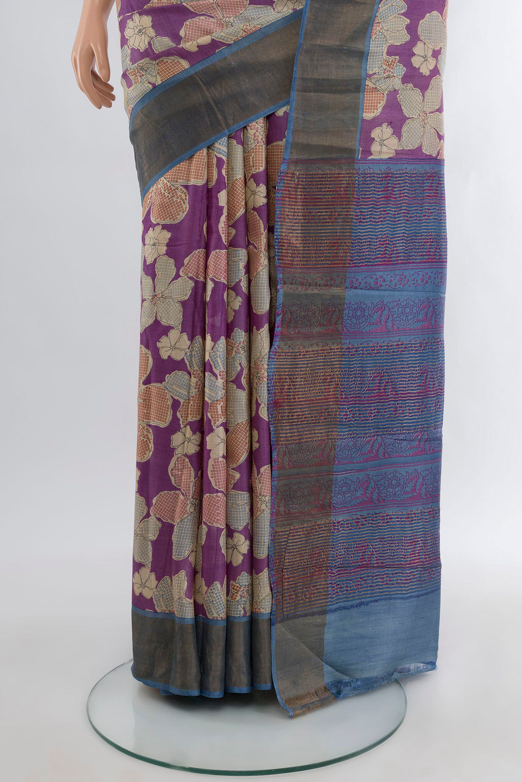 Pleats and pallu of Purple Tussar Silk Saree with Floral Print on the body and Zari Border. 