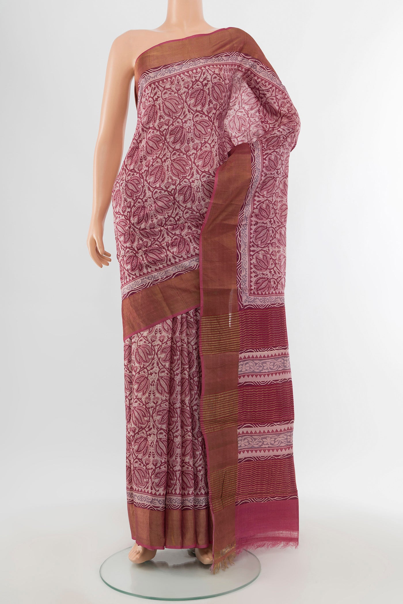 Dark Mauve Tussar Silk Saree with Printed design on the body and Zari Border.  displayed on a mannequin