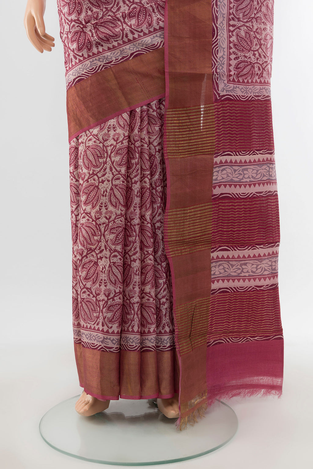 Pleats and pallu of Dark Mauve Tussar Silk Saree with Printed design on the body and Zari Border. 