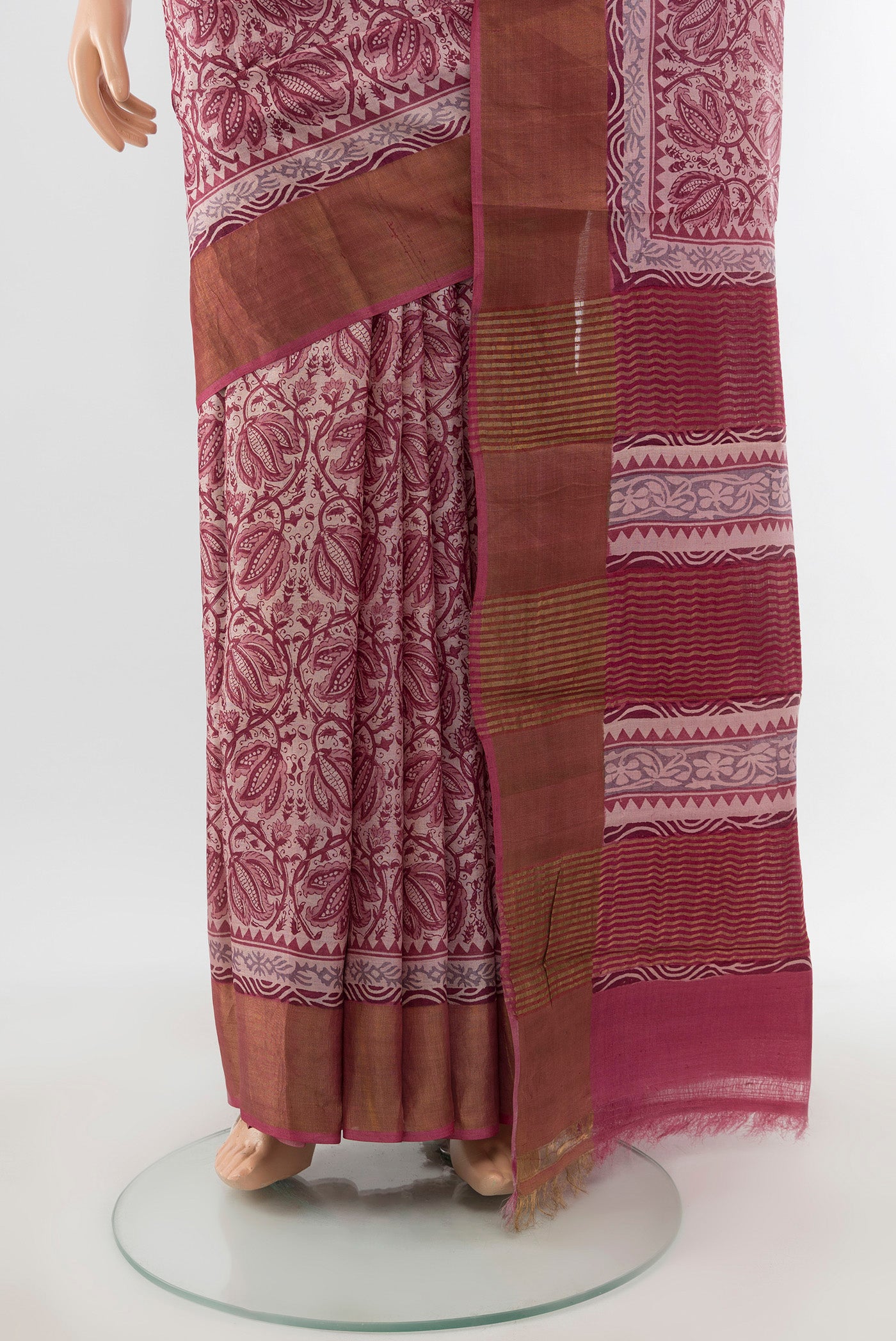 Pleats and pallu of Dark Mauve Tussar Silk Saree with Printed design on the body and Zari Border. 