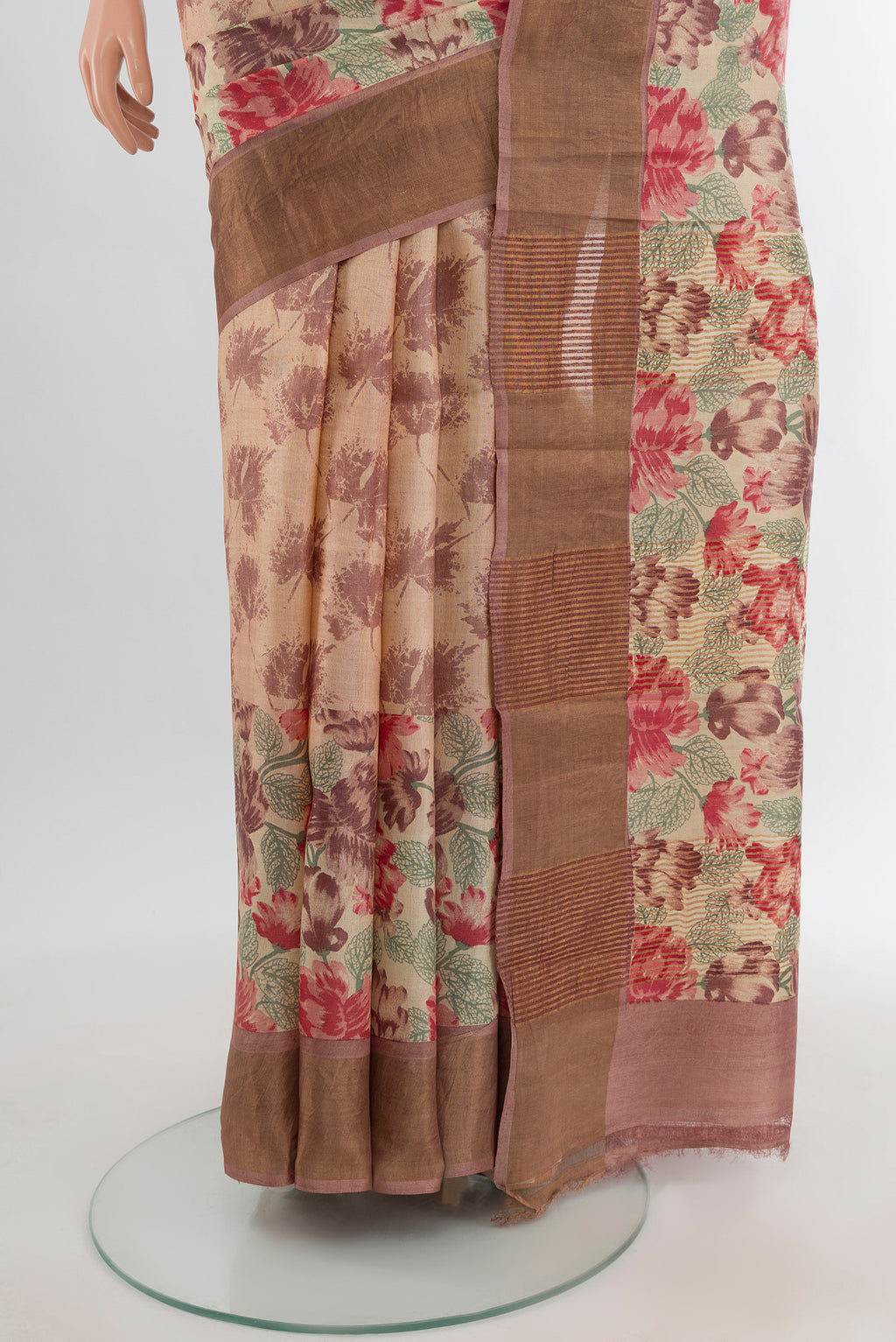 Pleats and pallu of Beige Tussar Silk Saree with Floral Print on the body and Zari Border. 