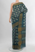 Green Tussar Silk Saree with Floral Print on the body and Zari Border.  displayed on a mannequin