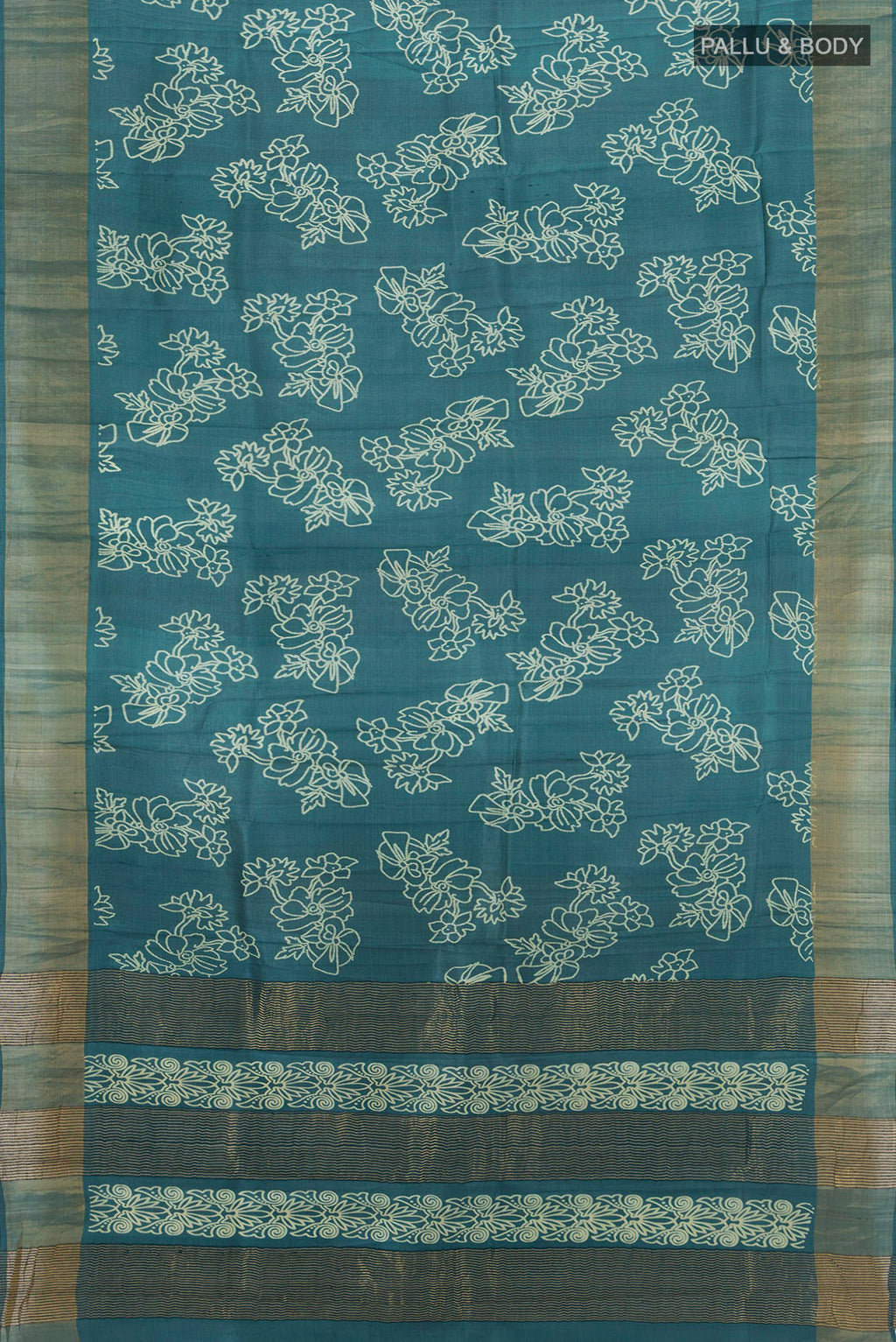 Flat view of Teal Tussar Silk Saree with Floral Print on the body and Zari Border. 