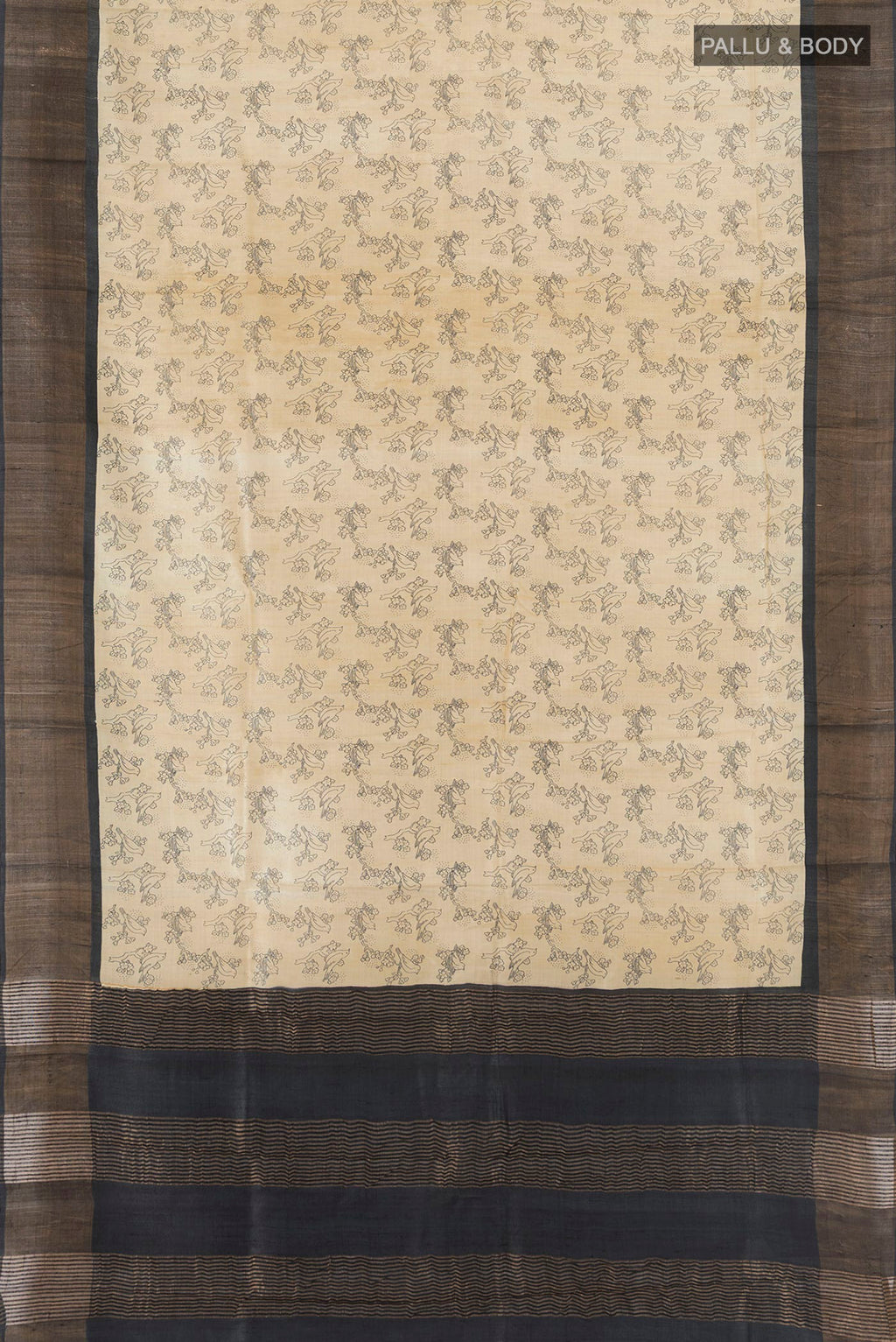 Flat view of Beige Tussar Silk Saree with Floral Print on the body and Zari Border. 