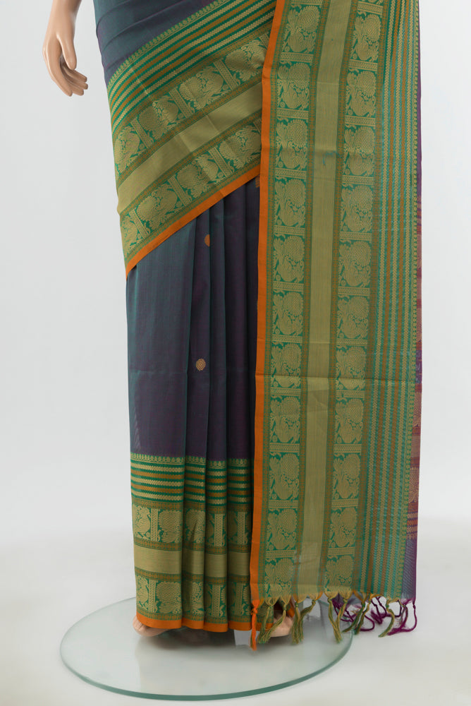 Pleats and pallu of Peacock Blue Kora Cotton Saree with Zari Butta on the body and Silk Border. 