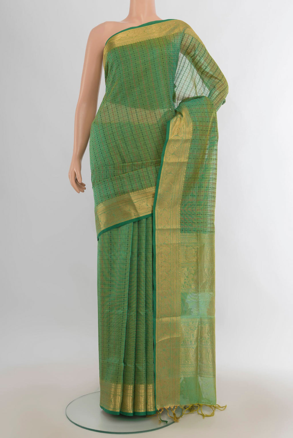 Olive Green Silk Cotton Saree with Zari Butta on the body and Silk Border.  displayed on a mannequin