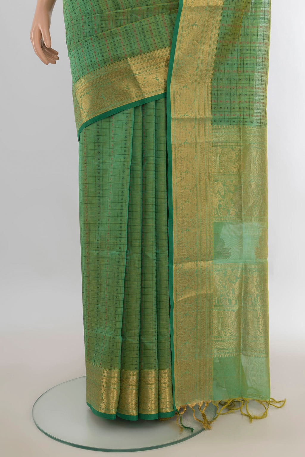 Pleats and pallu of Olive Green Silk Cotton Saree with Zari Butta on the body and Silk Border. 