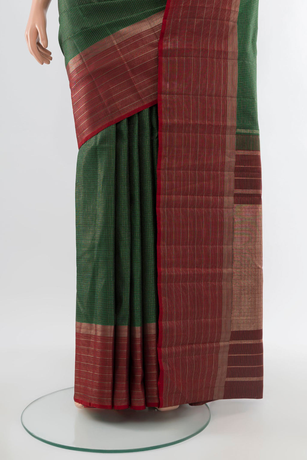 Pleats and pallu of Pure Silk Pure Zari Bottle Green Kanjivaram Saree with Zari Butta on the body and Silk Border. 