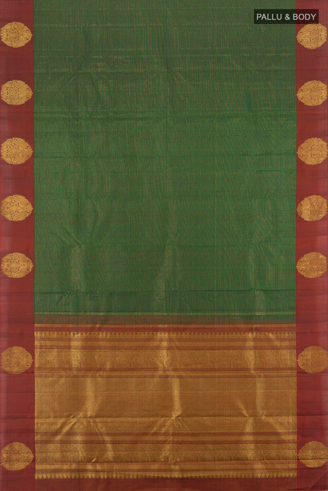 Flat view of Bottle Green Kanjivaram Silk Saree with Zari Butta on the body and Silk Border. 