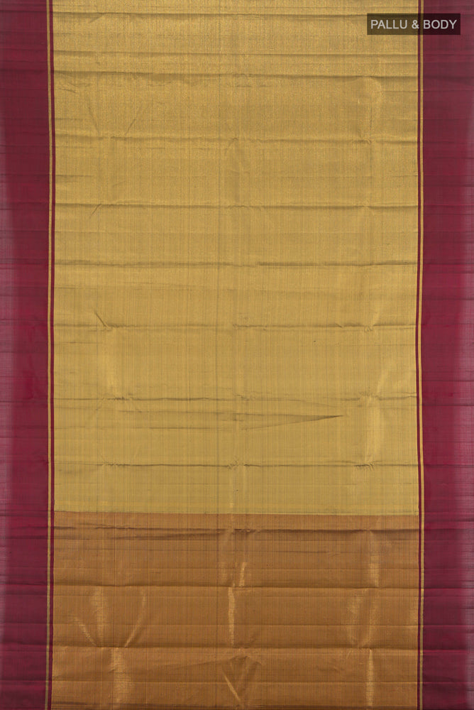 Flat view of Golden Kanjivaram Silk Saree with Zari Butta on the body and Silk Border. 