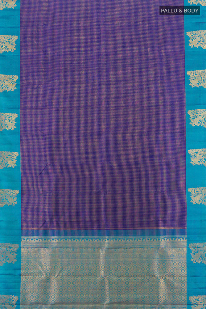 Flat view of Pure Silk Pure Zari Violet Kanjivaram Saree with Zari Butta on the body and Silk Border. 