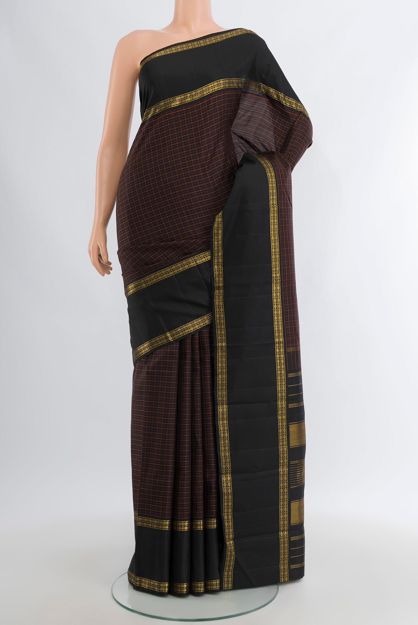 Black Kanjivaram Silk Saree with Checked design on the body and Zari Border.  displayed on a mannequin
