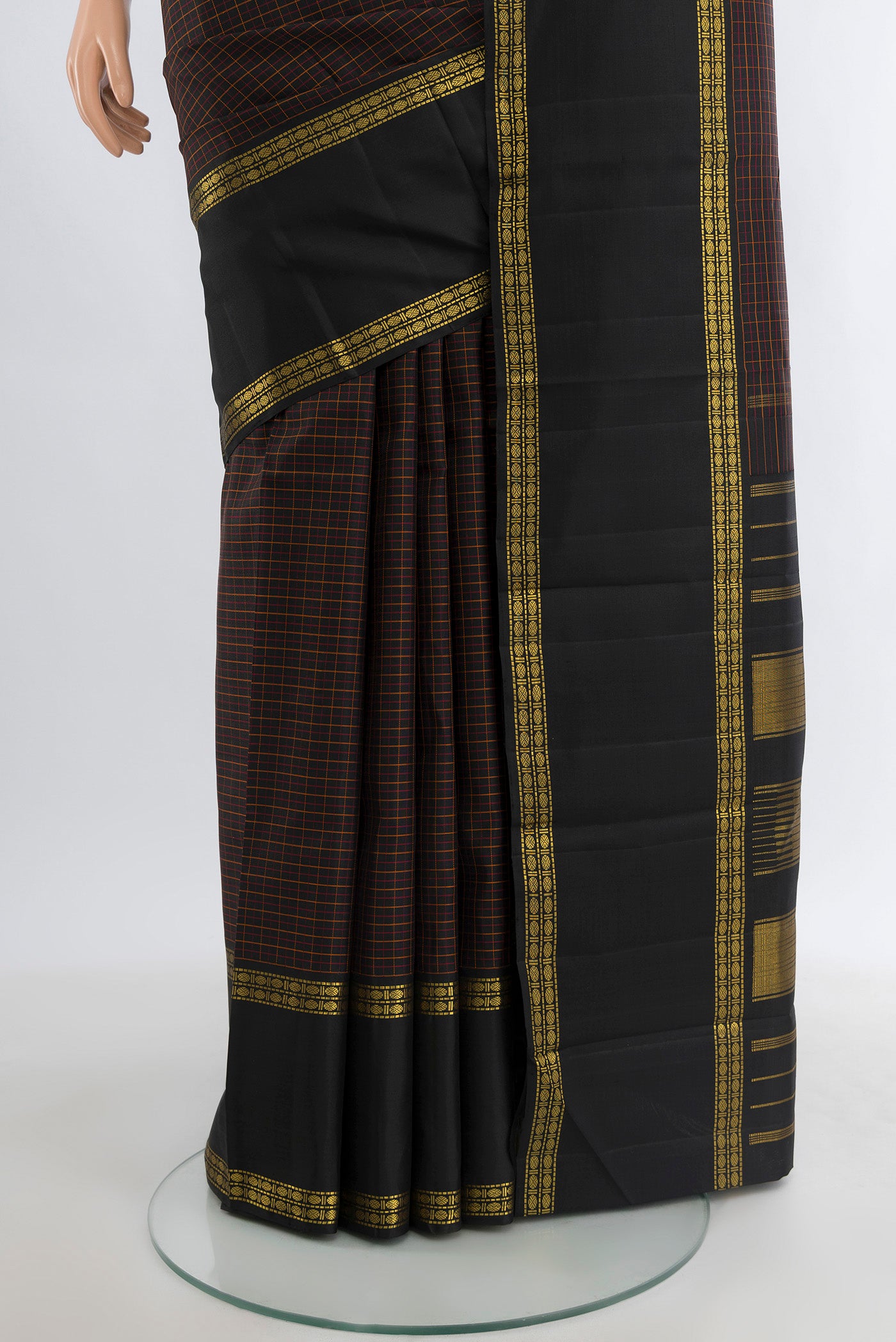 Pleats and pallu of Black Kanjivaram Silk Saree with Checked design on the body and Zari Border. 