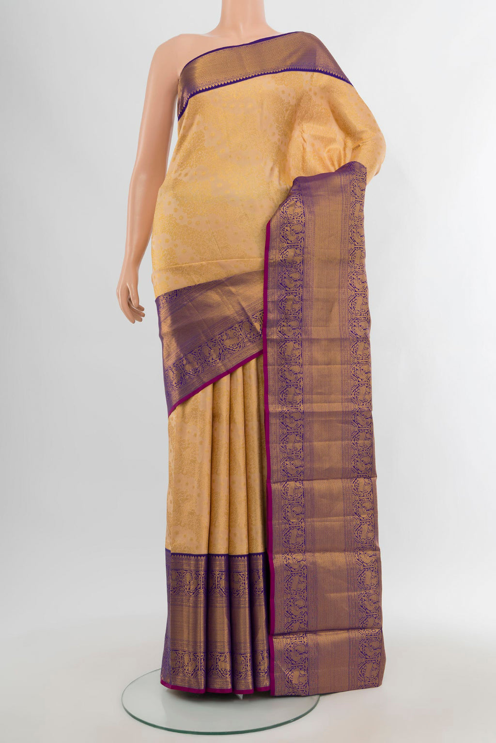 Sandal Kanjivaram Silk Saree with Zari Brocade on the body and Zari Border.  displayed on a mannequin