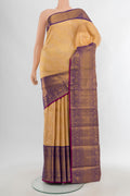 Sandal Kanjivaram Silk Saree with Zari Brocade on the body and Zari Border.  displayed on a mannequin