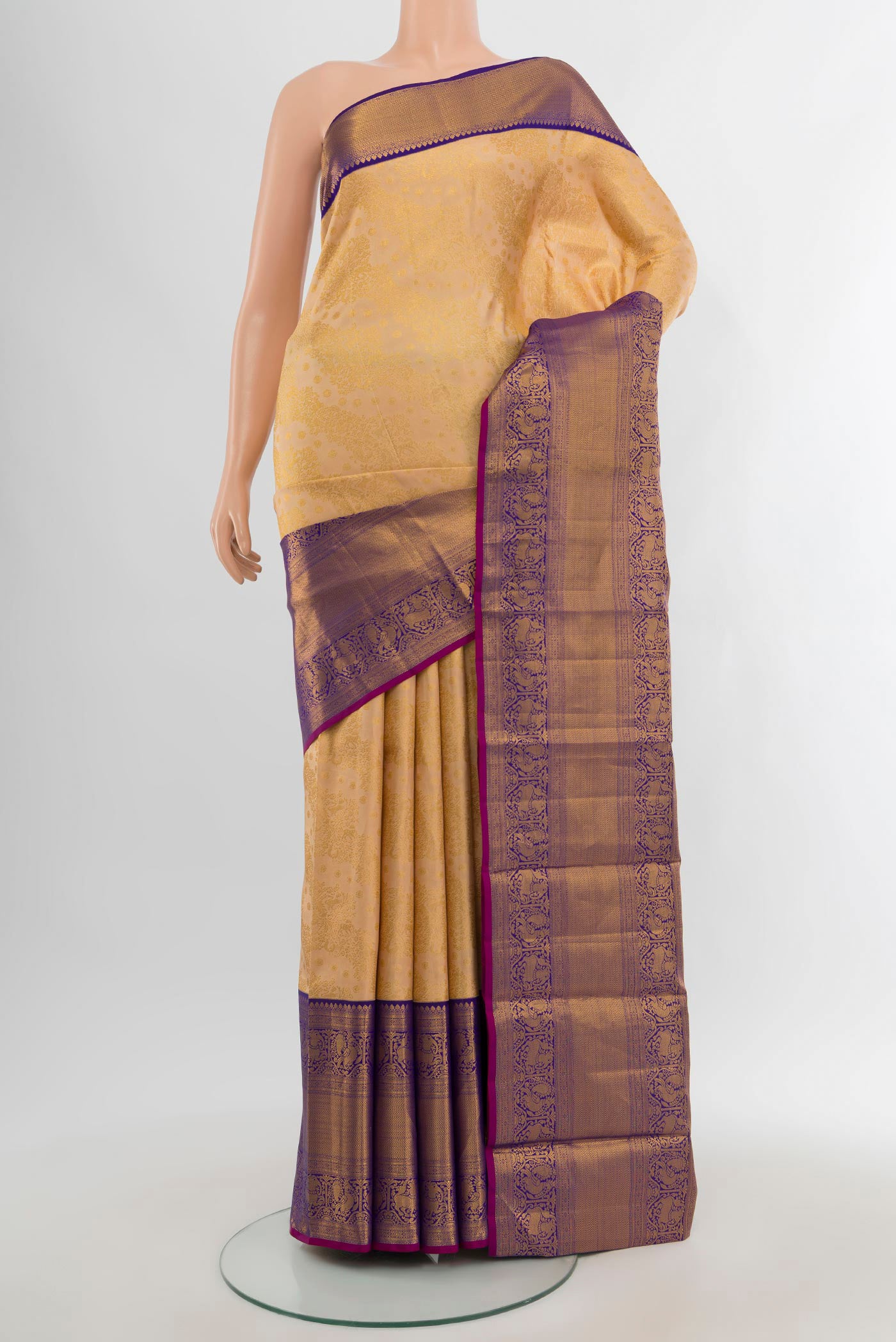 Sandal Kanjivaram Silk Saree with Zari Brocade on the body and Zari Border.  displayed on a mannequin