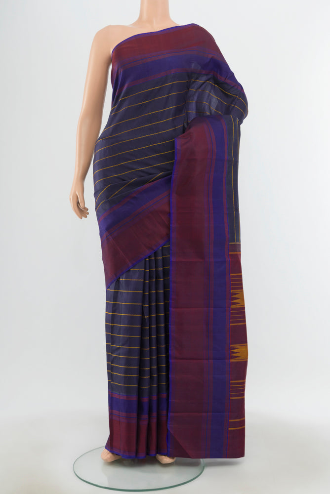 Pure Silk Pure Zari Multi Color Kanchipuram Saree with Zari Butta on the body and Silk Border.  displayed on a mannequin