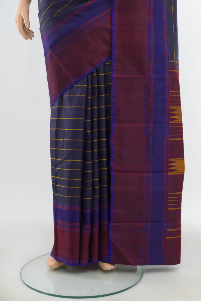 Pleats and pallu of Pure Silk Pure Zari Multi Color Kanchipuram Saree with Zari Butta on the body and Silk Border. 