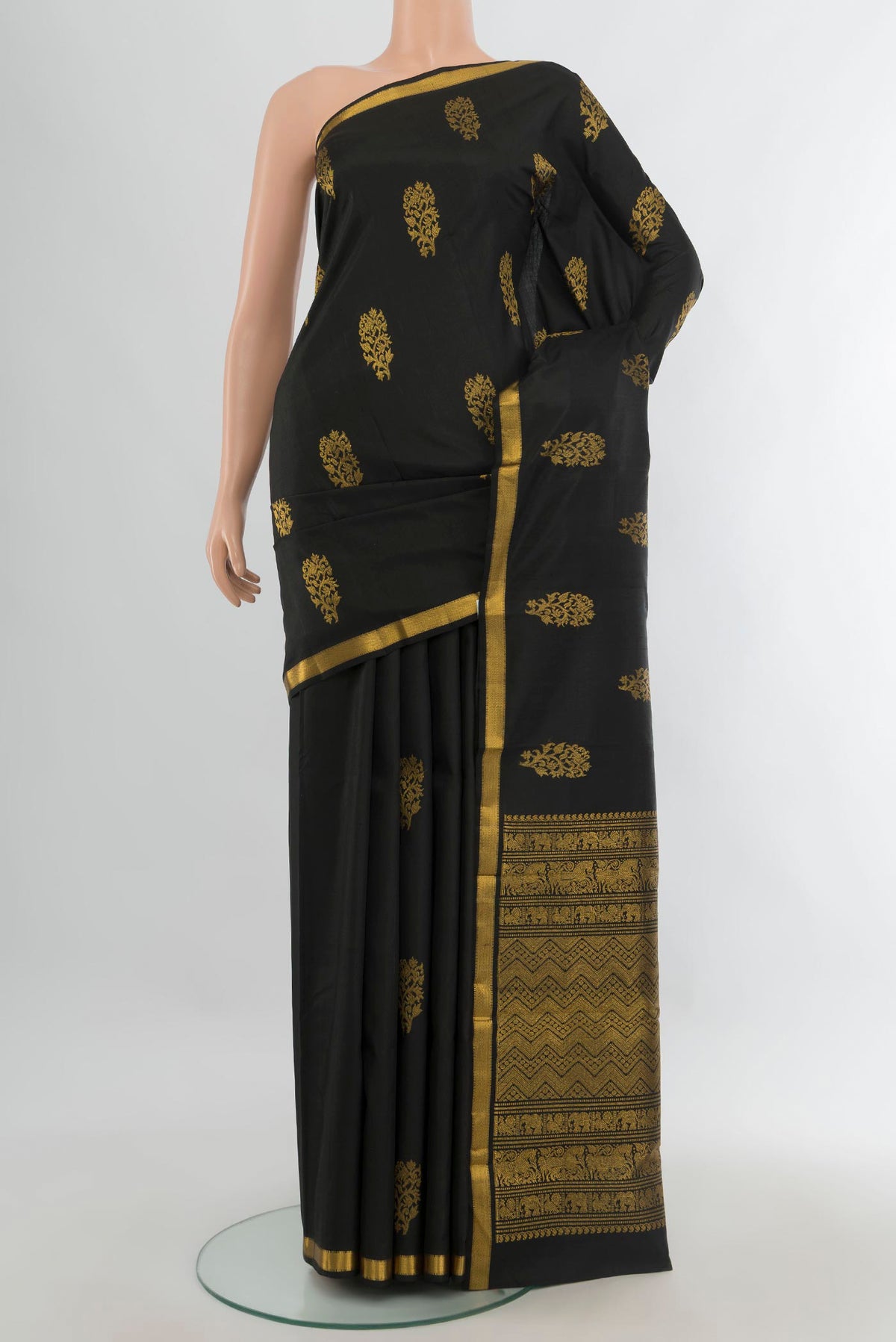Pure Silk Black Kanjivaram Saree with Zari Butta on the body and Zari Border.  displayed on a mannequin