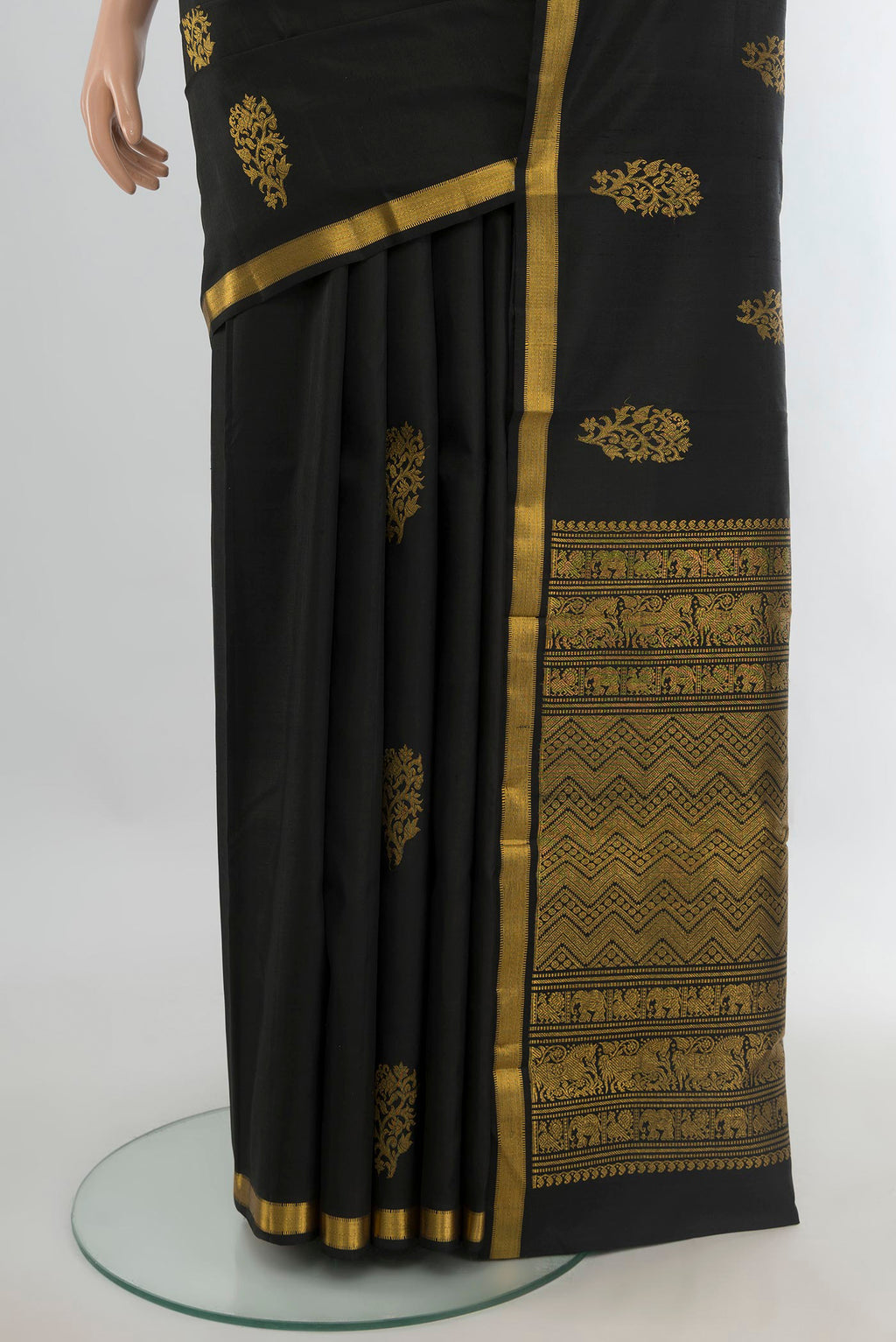 Pleats and pallu of Pure Silk Black Kanjivaram Saree with Zari Butta on the body and Zari Border. 