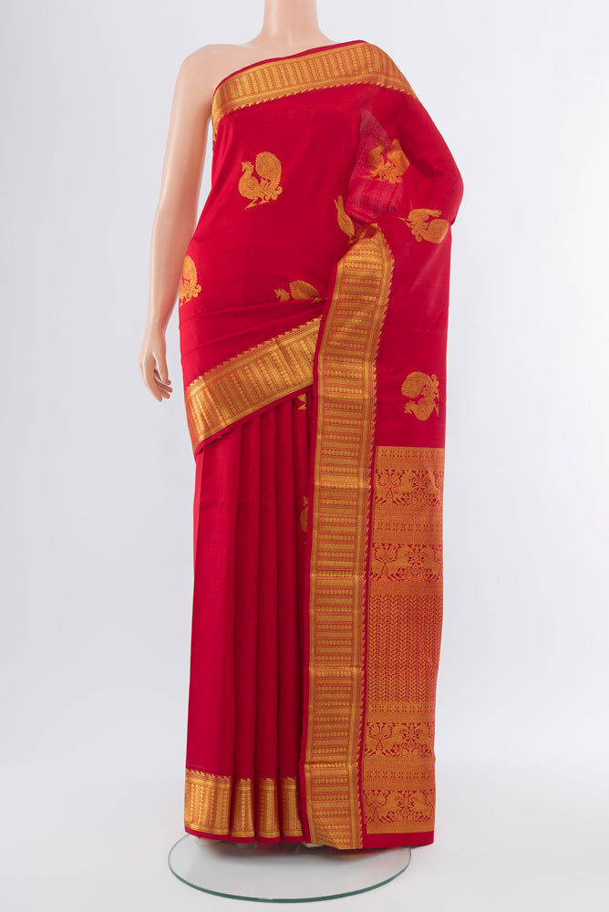 Red Kanjivaram Silk Saree with Zari Butta on the body and Silk Border.  displayed on a mannequin