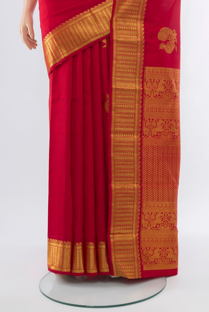 Pleats and pallu of Red Kanjivaram Silk Saree with Zari Butta on the body and Silk Border. 