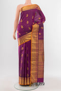 Purple Kanjivaram Silk Saree with Zari Butta on the body and Silk Border.  displayed on a mannequin