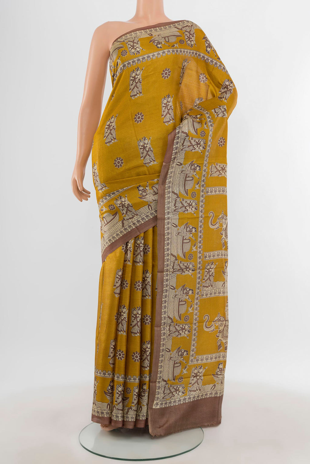 Mustard Tussar Silk Saree with Printed design on the body and Printed Border.  displayed on a mannequin