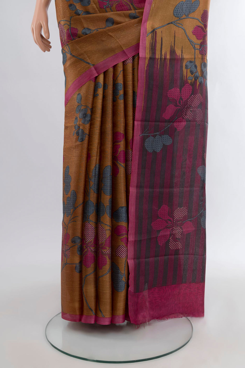 Pleats and pallu of Brown Tussar Silk Saree with Floral Print on the body and Plain Border. 