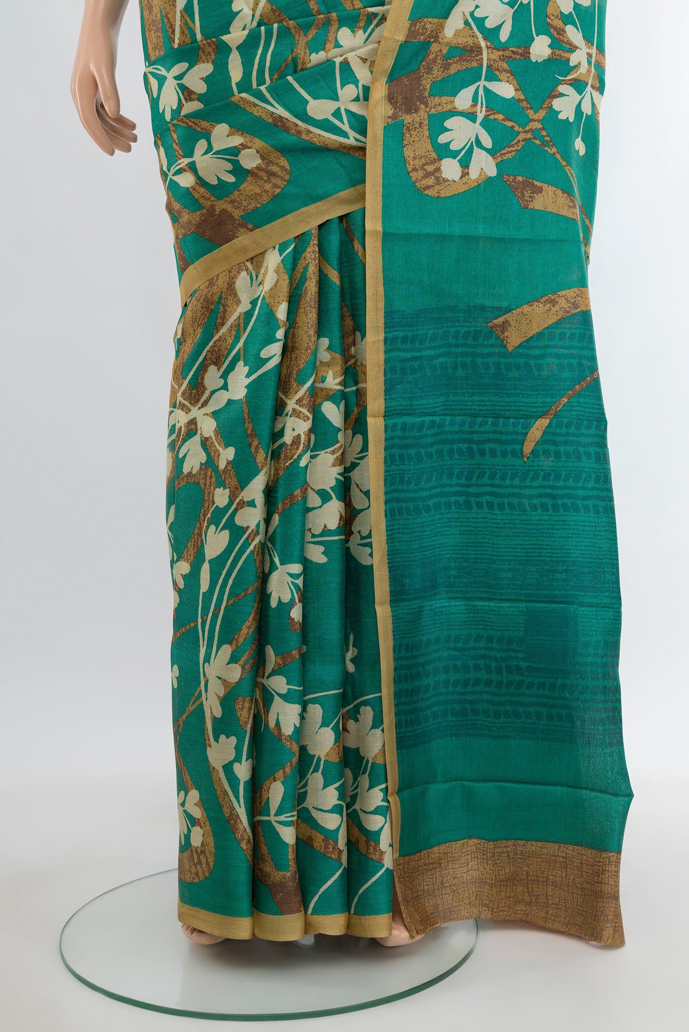 Pleats and pallu of Green Tussar Silk Saree with Floral Print on the body and Plain Border. 