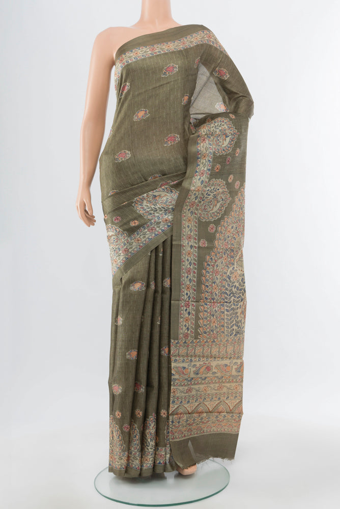 Light Green Tussar Silk Saree with Floral Print on the body and Silk Border.  displayed on a mannequin