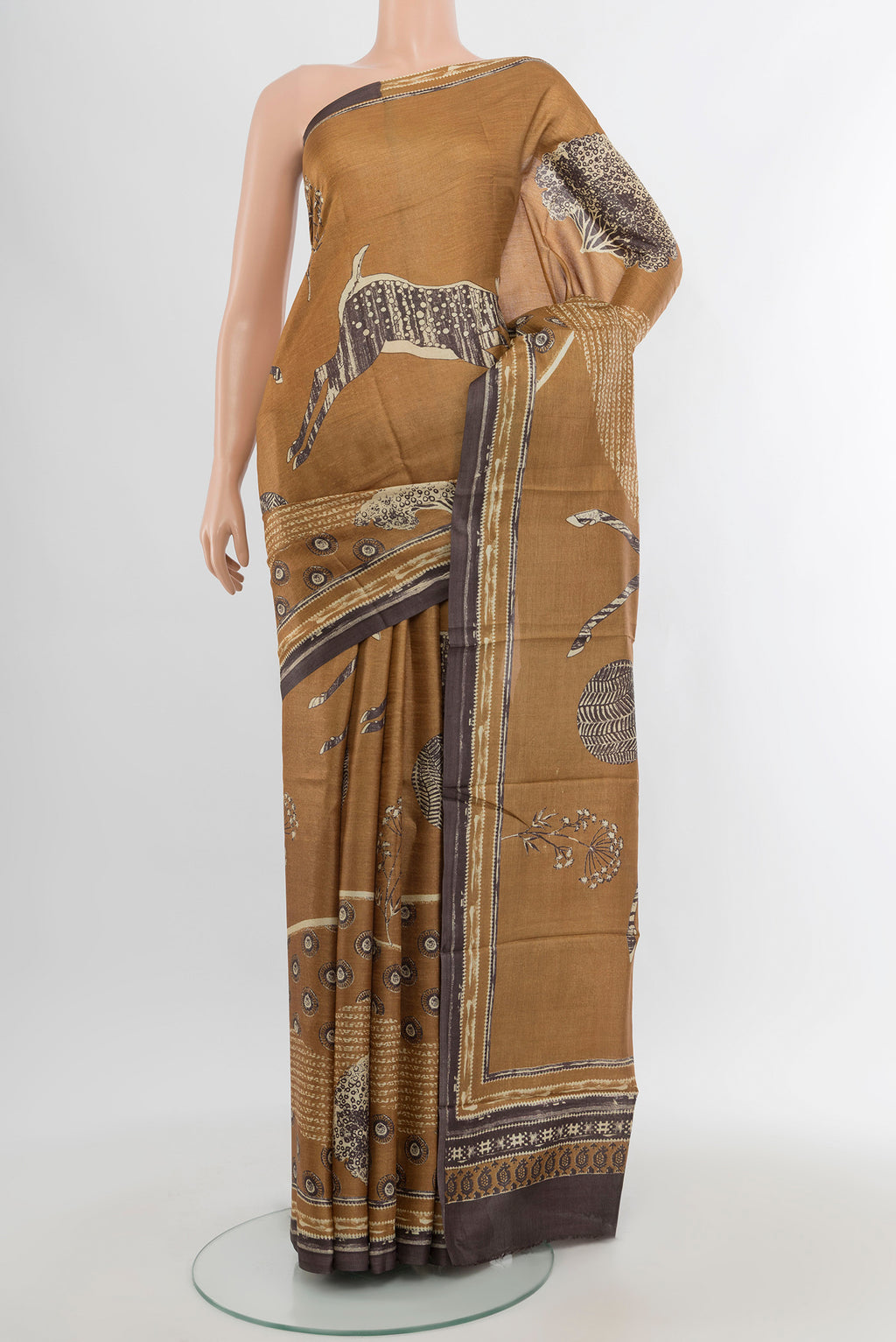 Beige Tussar Silk Saree with Floral Print on the body and Plain Border.  displayed on a mannequin