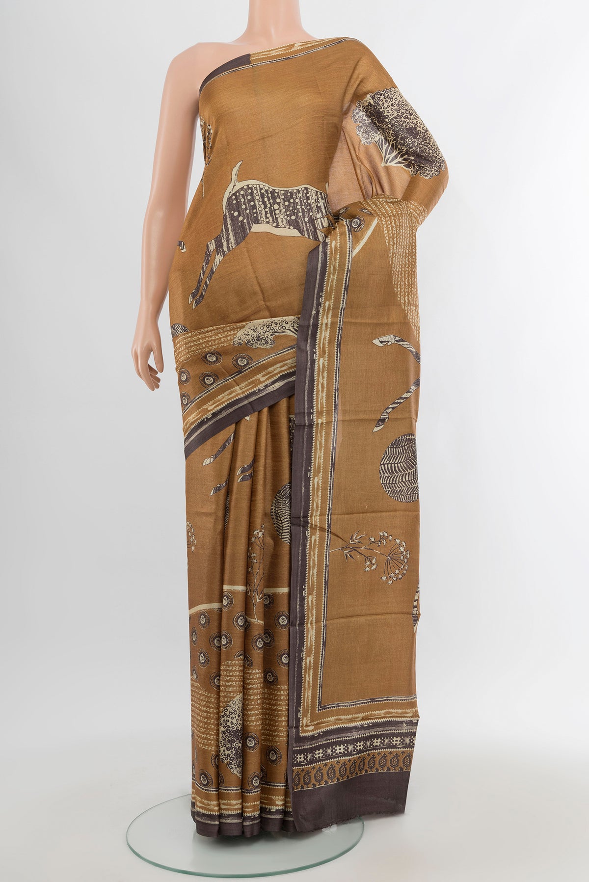 Beige Tussar Silk Saree with Floral Print on the body and Plain Border.  displayed on a mannequin