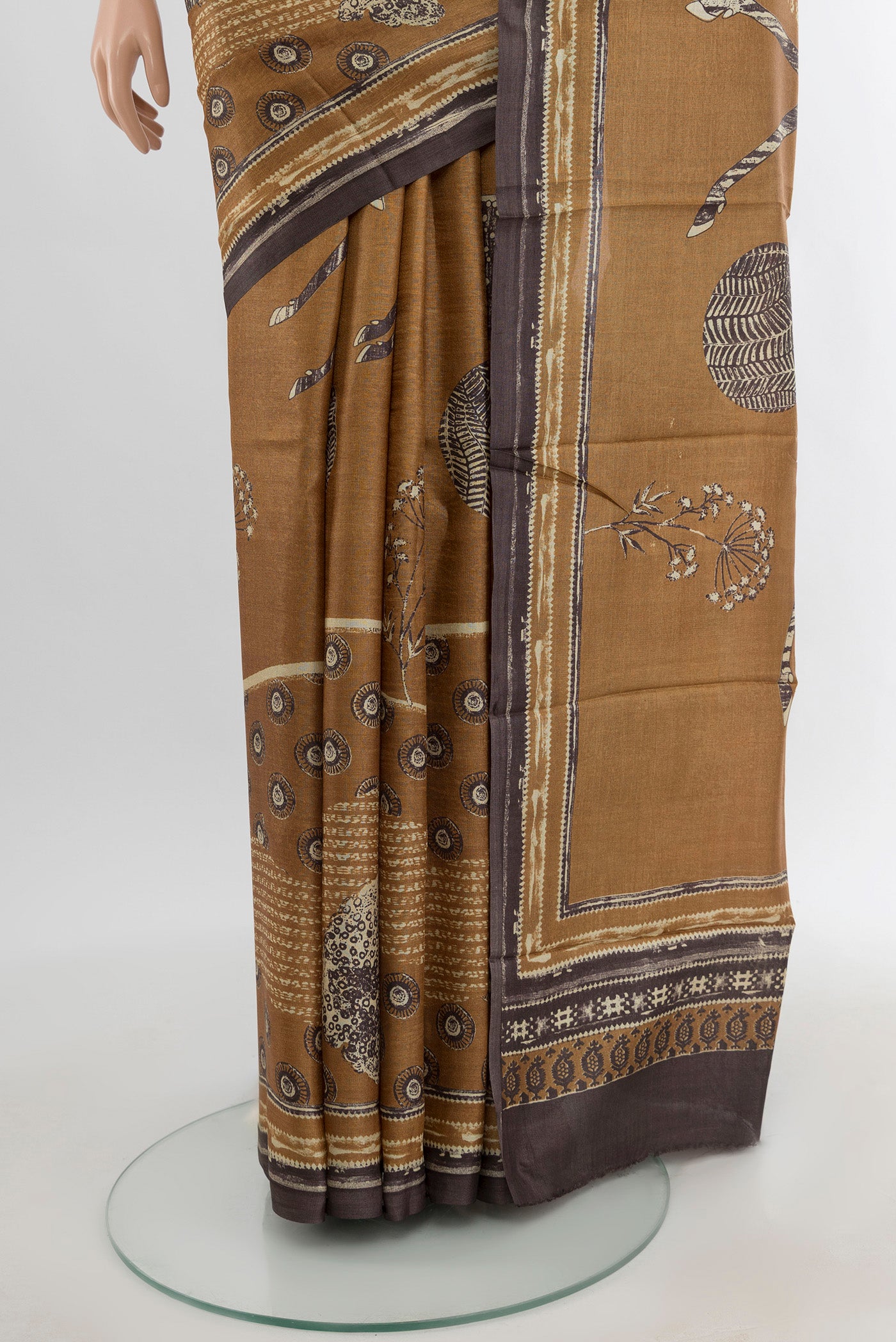 Pleats and pallu of Beige Tussar Silk Saree with Floral Print on the body and Plain Border. 