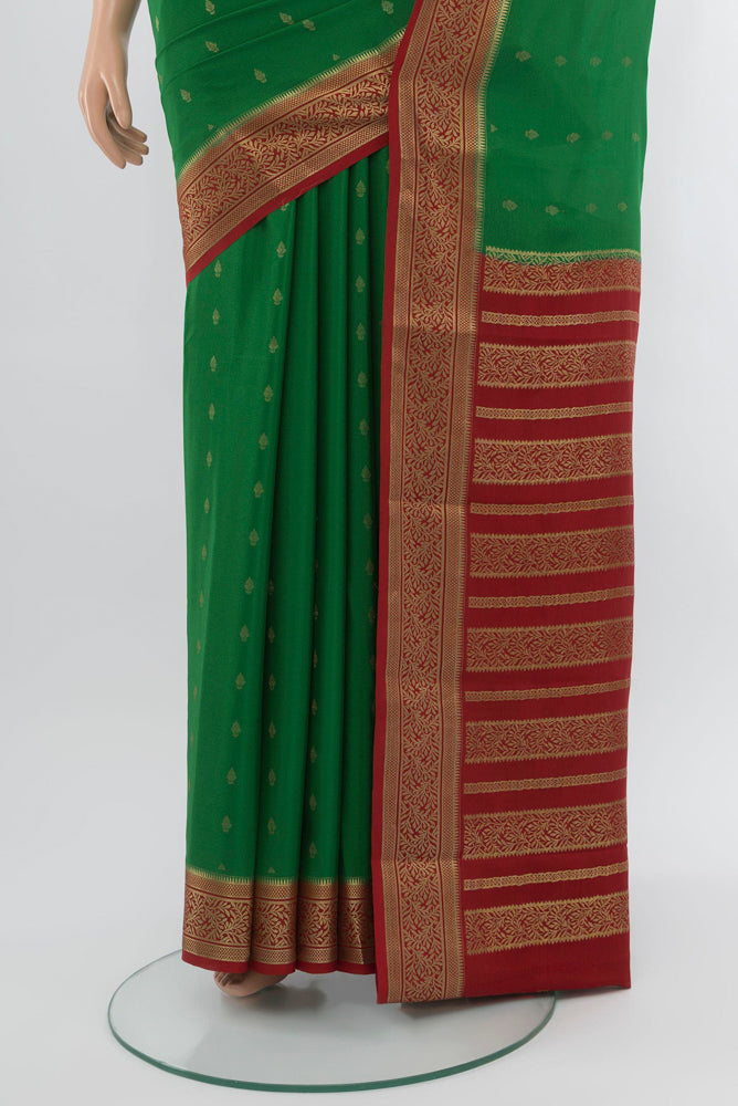 Pleats and pallu of Mint Green Mysore Crepe Saree with Zari Butta on the body and Zari Border. 
