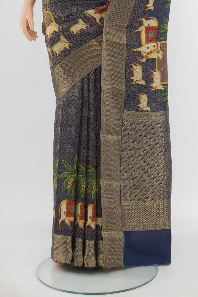Pleats and pallu of Navy Blue Mysore Georgette Saree with Zari Butta on the body and Silk Border. 
