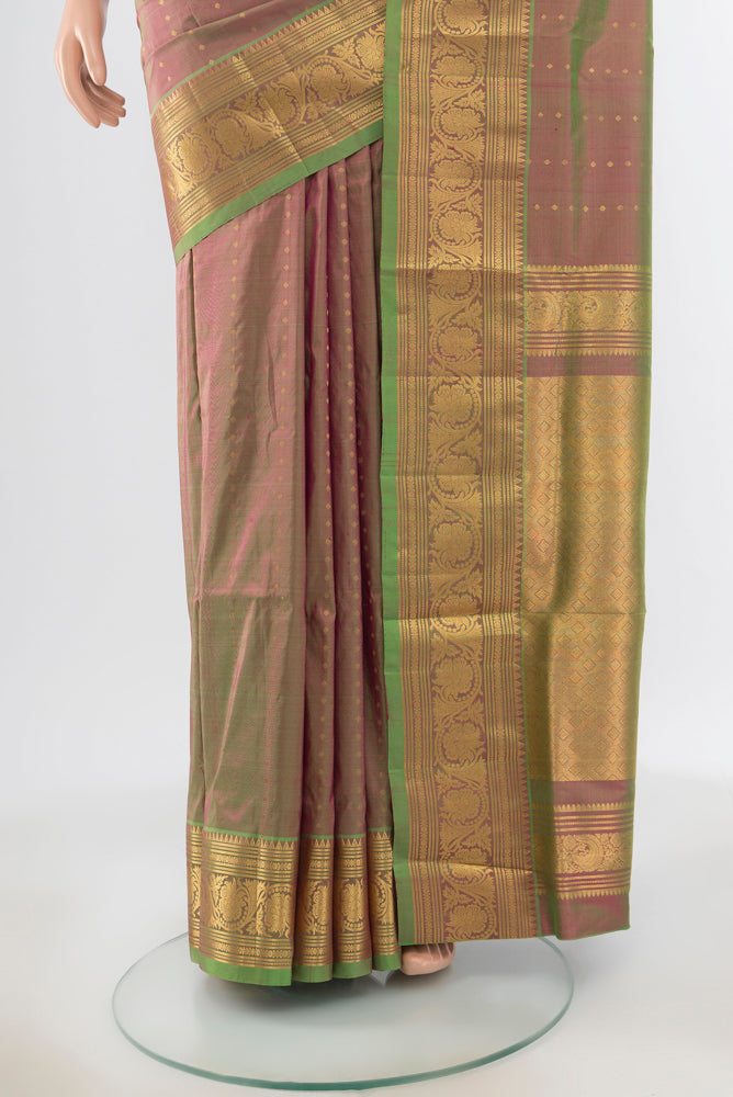Pleats and pallu of Light Green Kanjivaram Silk Saree with Zari Butta on the body and Silk Border. 