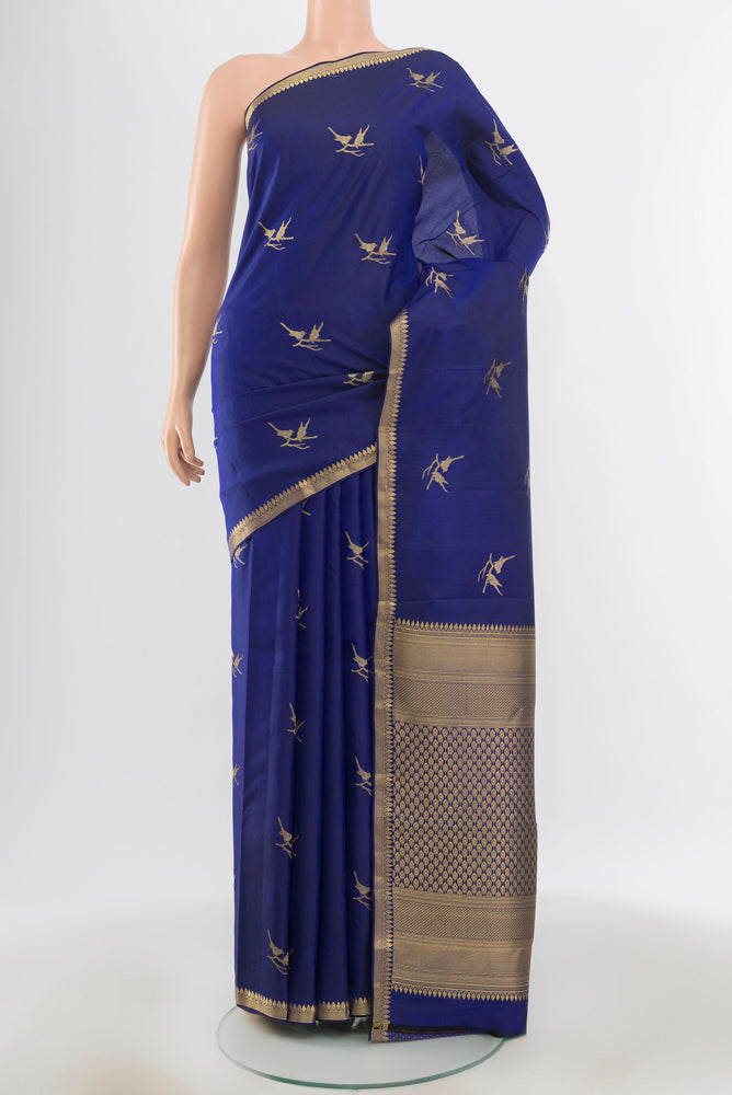 Pure Silk Pure Zari Dark Blue Kanchipuram Saree with Zari Butta on the body and Silk Border.  displayed on a mannequin