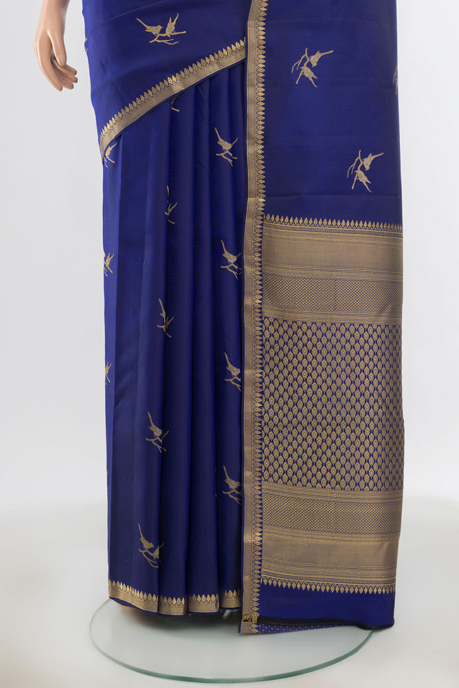 Pleats and pallu of Pure Silk Pure Zari Dark Blue Kanchipuram Saree with Zari Butta on the body and Silk Border. 