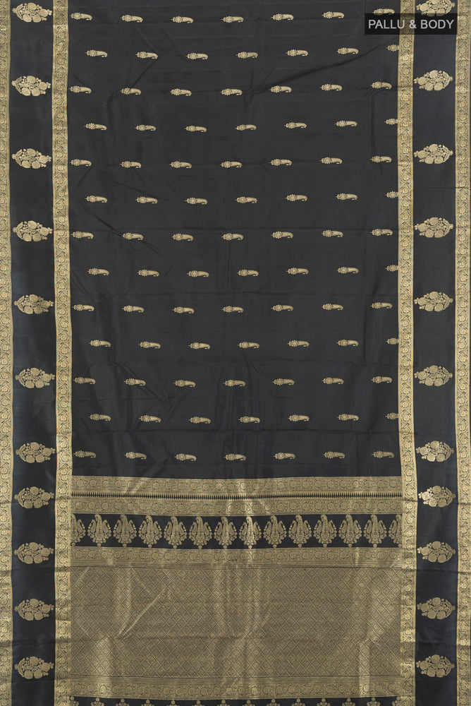 Flat view of Pure Silk Pure Zari Black Kanchipuram Saree with Zari Butta on the body and Silk Border. 