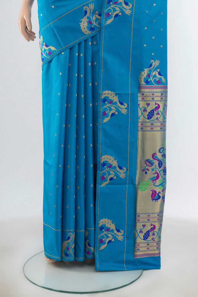 Pleats and pallu of Light Blue Soft Silk Saree with Zari Butta on the body and Silk Border. 