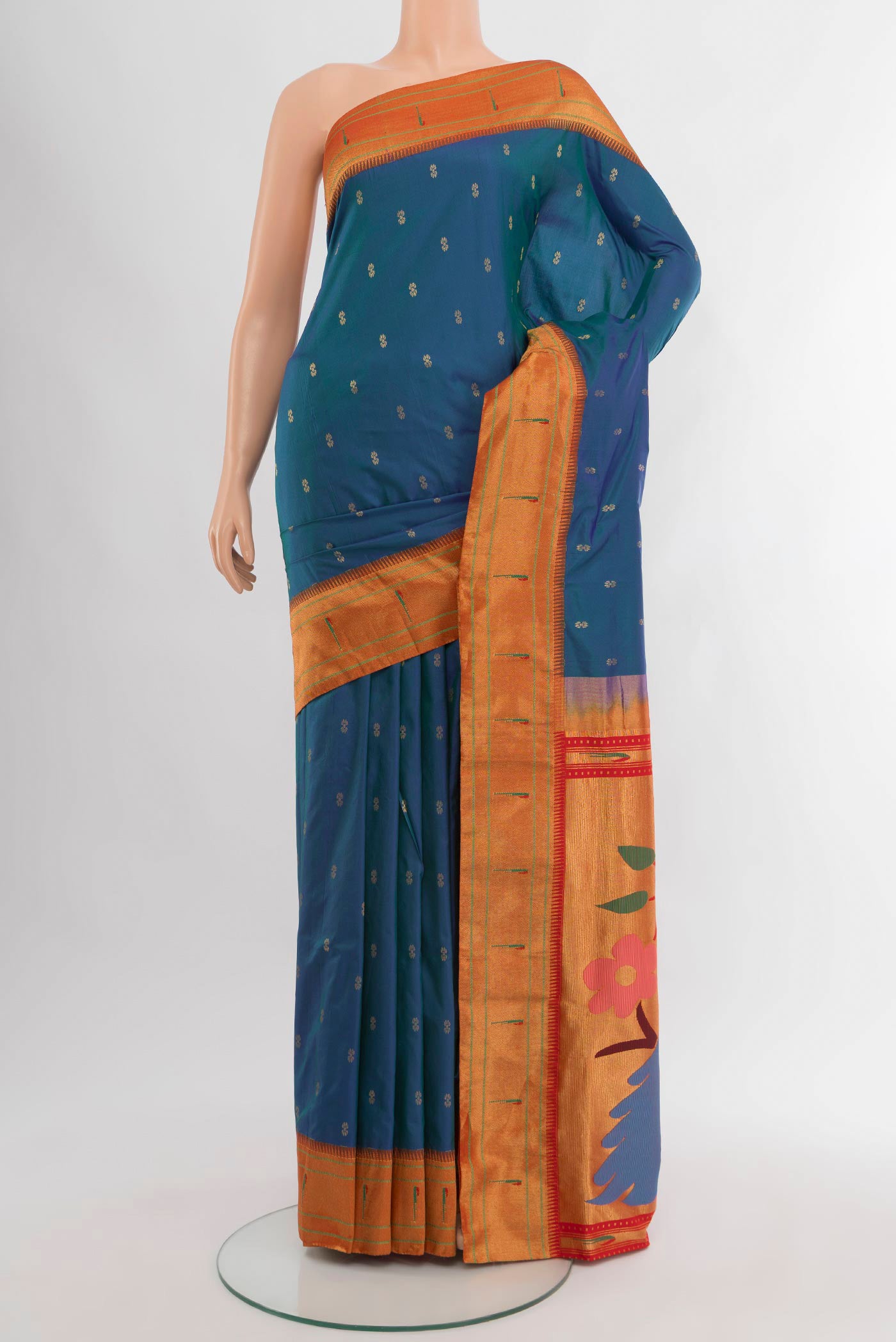 Peacock Blue Paithani Silk Saree with Zari Butta on the body and Paithani Border.  displayed on a mannequin