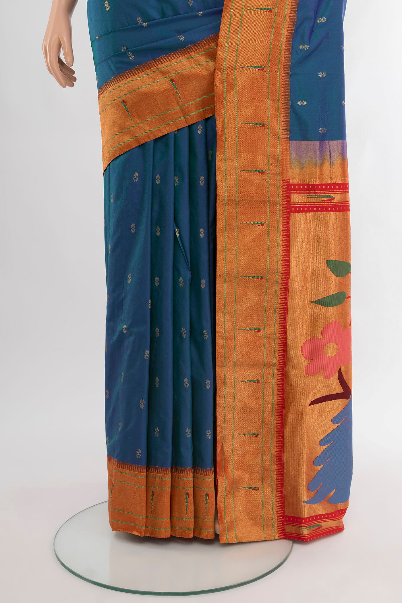 Pleats and pallu of Peacock Blue Paithani Silk Saree with Zari Butta on the body and Paithani Border. 