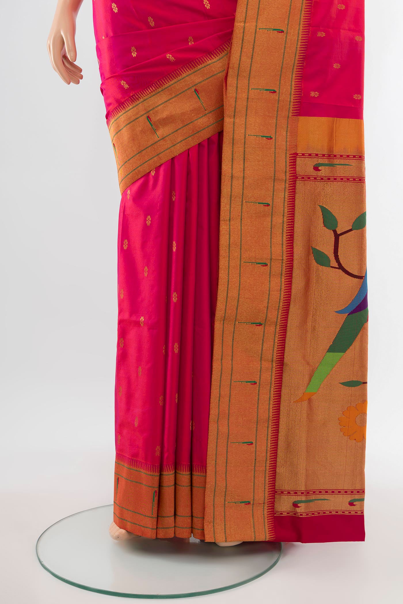 Pleats and pallu of Golden Peach Soft Silk Saree with Zari Butta on the body and Silk Border. 