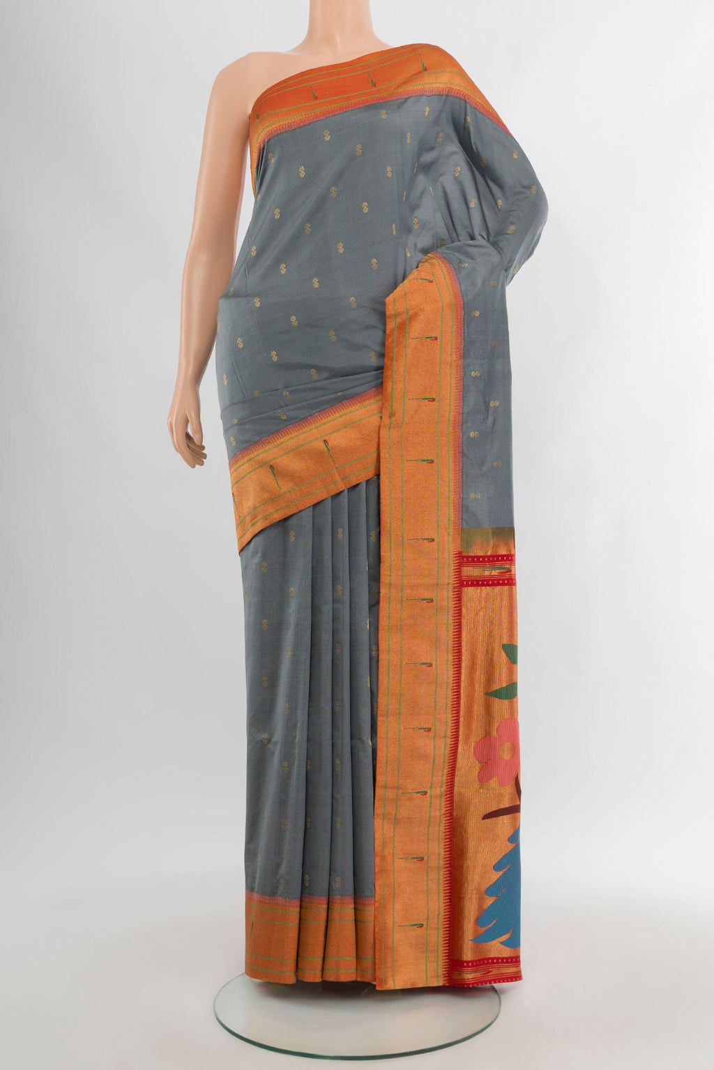 Grey Paithani Silk Saree with Zari Butta on the body and Paithani Border.  displayed on a mannequin