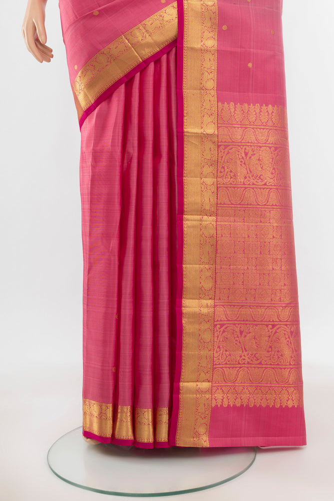 Pleats and pallu of Pure Silk Pure Zari Peach Kanjivaram Saree with Zari Butta on the body and Silk Border. 