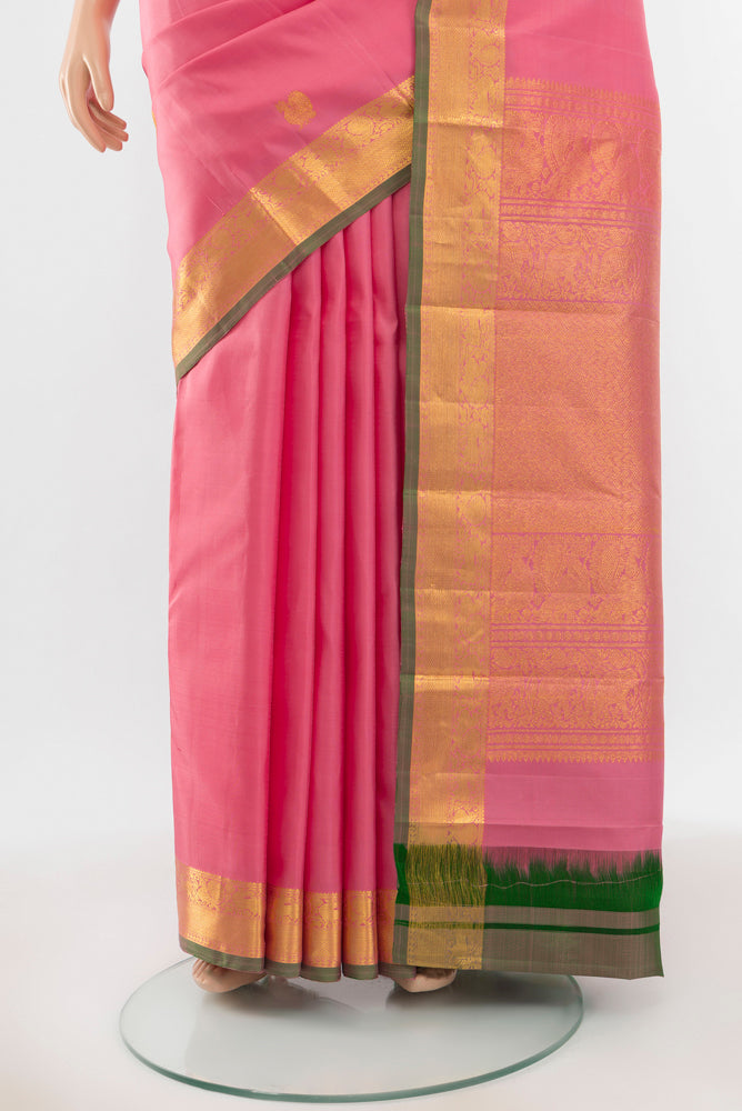 Pleats and pallu of Pure Silk Pure Zari Peach Kanjivaram Saree with Zari Butta on the body and Silk Border. 