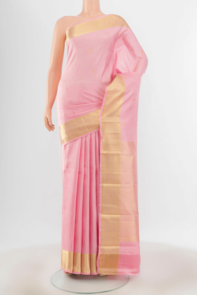 Pure Silk Pure Zari Rose Gold Kanjivaram Saree with Zari Butta on the body and Silk Border.  displayed on a mannequin