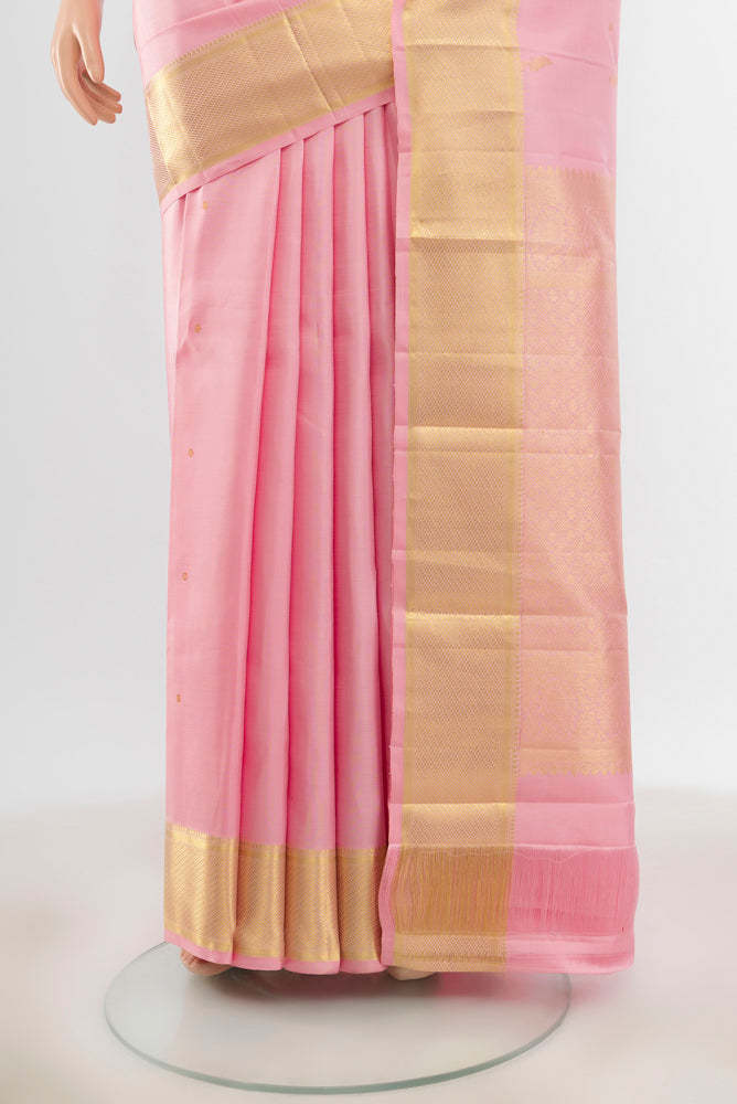 Pleats and pallu of Pure Silk Pure Zari Rose Gold Kanjivaram Saree with Zari Butta on the body and Silk Border. 