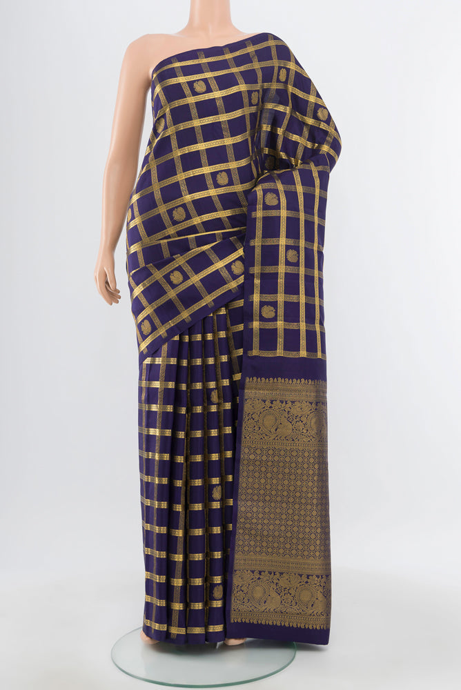 Pure Silk Pure Zari Navy Blue Kanjivaram Saree with Zari Brocade on the body and Silk Border.  displayed on a mannequin